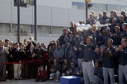 03_2215D ©Th.Martinez Team .Geneva , Switzerland. America's Cup 2003. 8th March 2003.Alinghi Team winner of America's Cup 2003, arriving in Geneva Airport with the America's Cup..Ernesto Bertraelli (Alinghi's president and navigator) holding up the Cup to media during welcome cermony at Geneva Airport with all Alinghi team behind him....