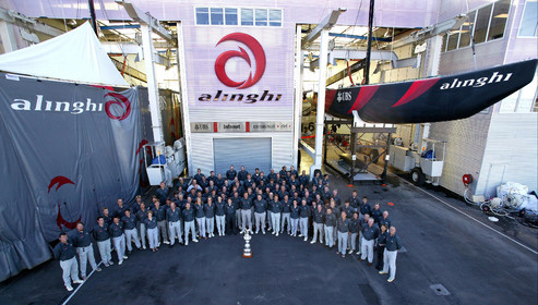 03_1511D ©Th.Martinez . Auckland New Zealand. 3rd March 2003. Alinghi Team winner of the 31 America's Cup around the Cup in front of the boat shed at Alinghi Base.