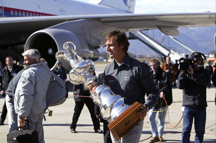 03_2211D ©Th.Martinez Team .Geneva , Switzerland. America's Cup 2003. 8th March 2003.Alinghi Team winner of America's Cup 2003, arriving in Geneva Airport with the America's Cup. Ernesto Bertarelli (Alinghi's president and navigator) with the Cup going out the plane....
