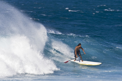 Stand Up Paddle  in waves at Hookip'a Beach - North Shore Maui - Hawaii.