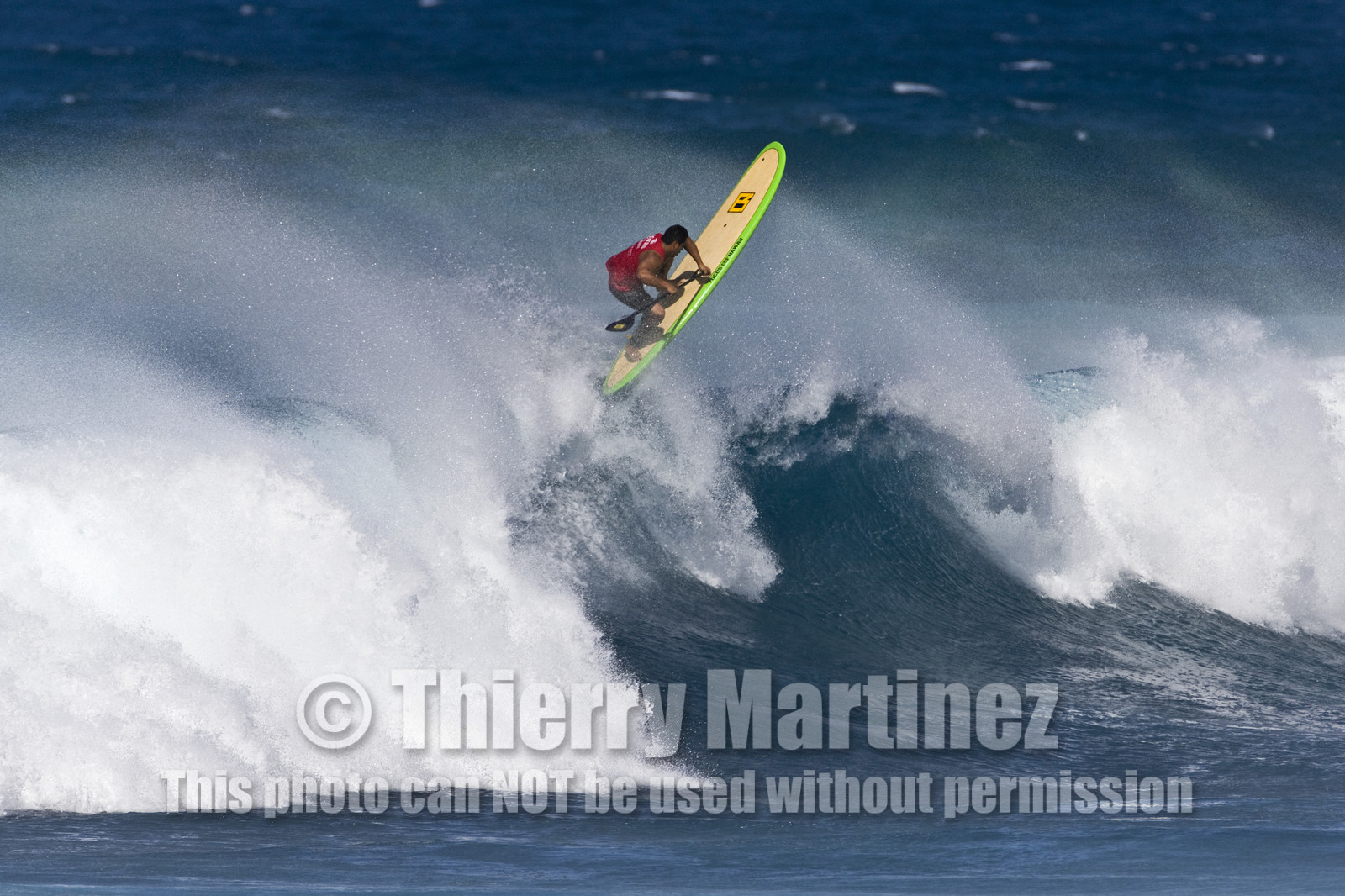 Stand Up Paddle  in waves at Hookip'a Beach - North Shore Maui - Hawaii.