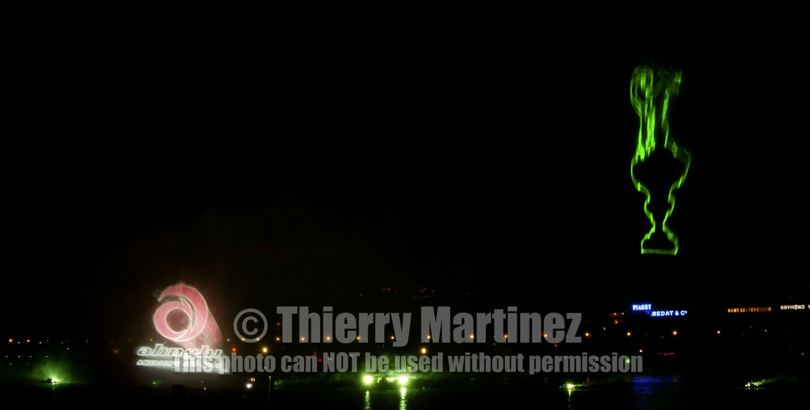 03_2265D ©Th.MartinezTeam .Geneva , Switzerland. America's Cup 2003. 8th March 2003.Alinghi Team winner of America's Cup 2003..Welcome to Alinghi Team in Geneva.Firework and laser show by the lac...