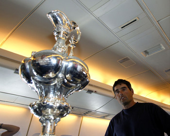 03_2200D ©Th.Martinez - Airplane (Auckland to Geneva) . America's Cup 2003. 8th March 2003.Alinghi Team winner of America's Cup 2003..Alinghi's skipper Russell Coutts looking at the trophy  he won tree time in a row, in the plane back to Geneva....