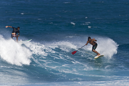Stand Up Paddle  in waves at Hookip'a Beach - North Shore Maui - Hawaii.