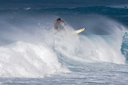 Stand Up Paddle  in waves at Hookip'a Beach - North Shore Maui - Hawaii.