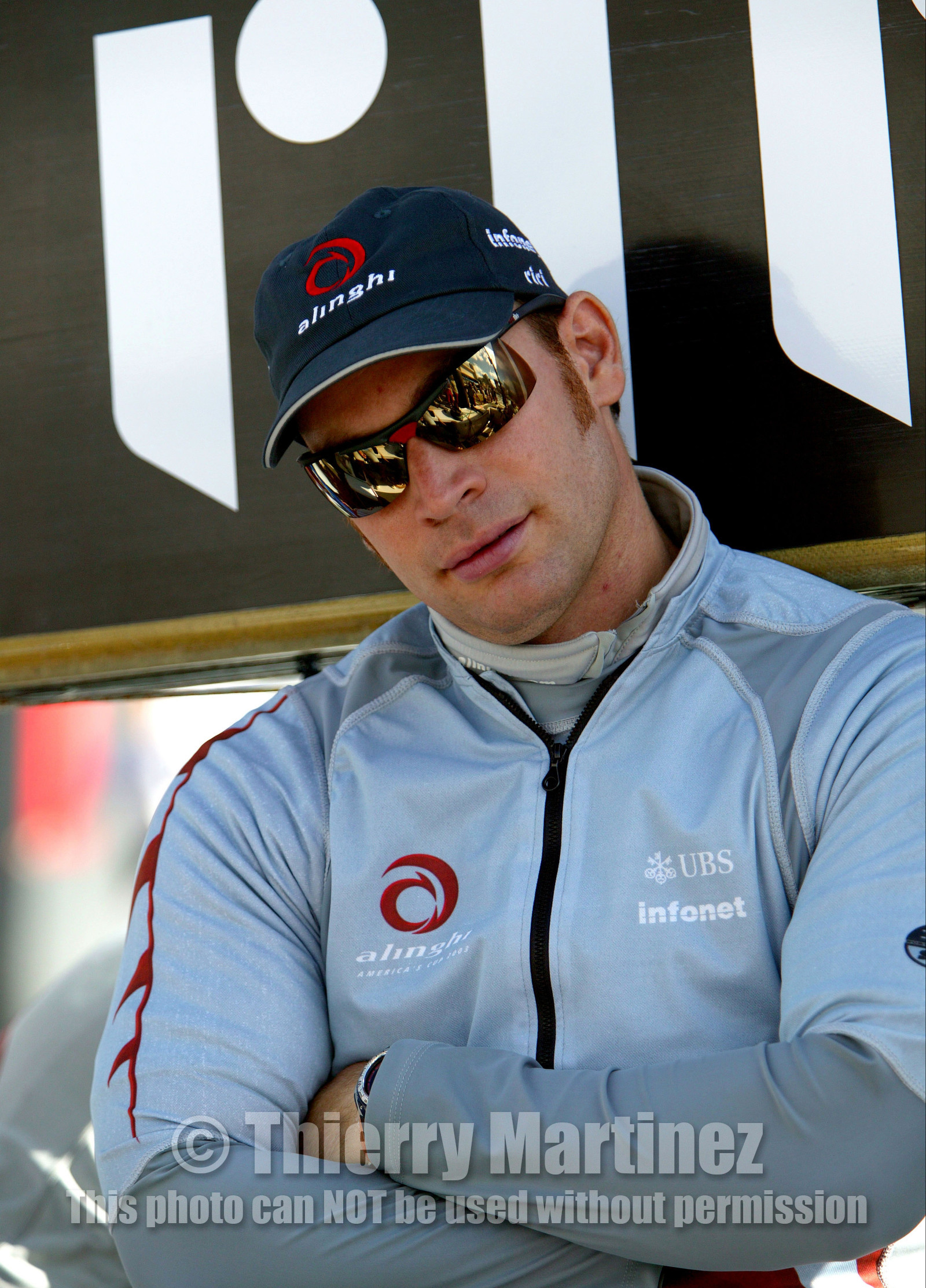 03_0877D © Th.Martinez. Auckland   New Zealand. 15 02 03 America's Cup Day 1.Alinghi (SUI64) vs Team New Zealand (NZL82)Alinghi Team onboard SUI64 leaving the dock for the .first race day of the America's Cup 2003. Alinghi grinder, Dominik Neidhart