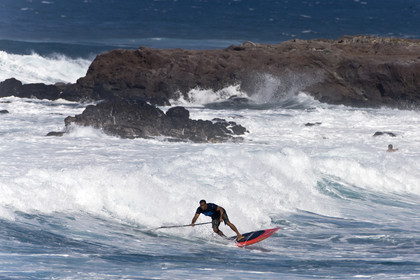 Stand Up Paddle  in waves at Hookip'a Beach - North Shore Maui - Hawaii.