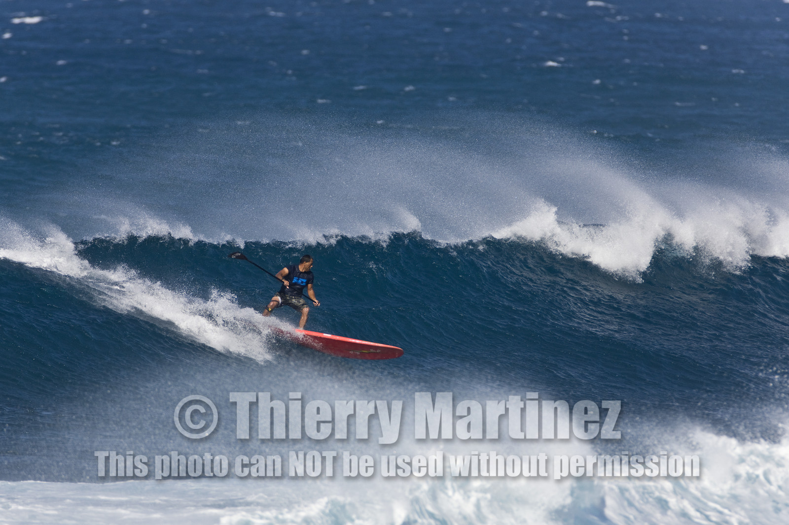 Stand Up Paddle  in waves at Hookip'a Beach - North Shore Maui - Hawaii.