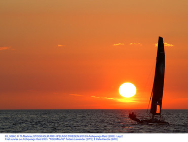 03_3096D © Th.Martinez,STOCKHOLM ARCHIPELAGO SWEDEN,9 07 03-Archipelago Raid (2003)  Leg 2.First sunrise on Archipelago Raid 2003. TIDERMANS Anders Lewander (SWE) & Calle Hendix (SWE)