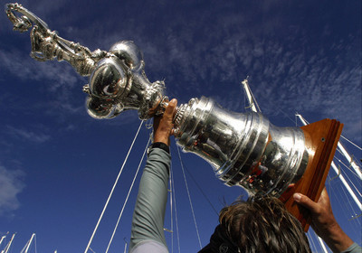 03_1508D ©Th.Martinez - Auckland (NZ) . America's Cup 2003. 2nd March 2003.Alinghi Team winner of America's Cup 2003..Jochen Schuemann holding the America's Cup ..