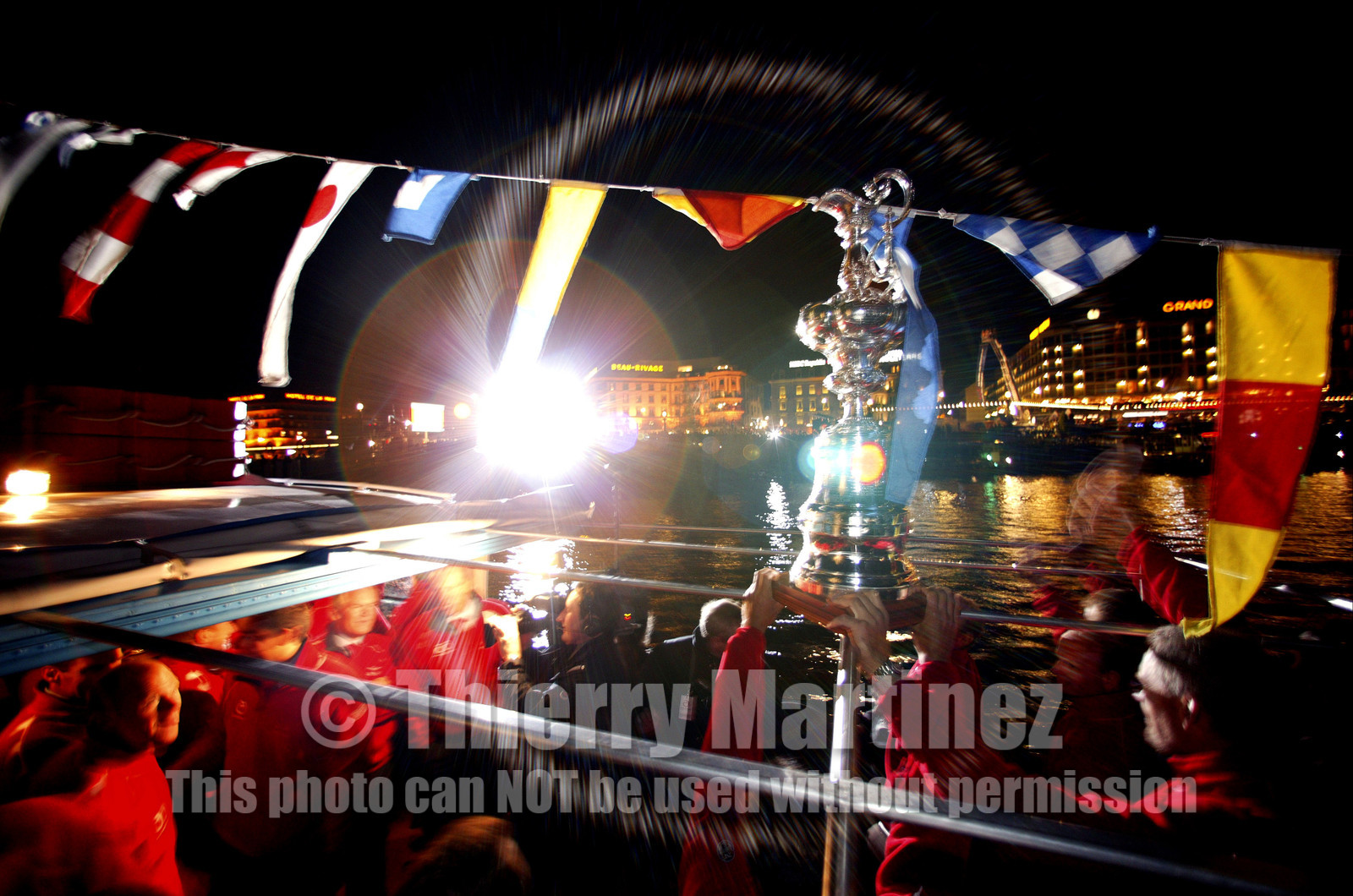 03_2241D ©Th.Martinez .Geneva , Switzerland. America's Cup 2003. 8th March 2003.Alinghi Team winner of America's Cup 2003..Welcome to Alinghi Team in Geneva. The America's Cup and Alinghi Team on the way to La Rotonde ..