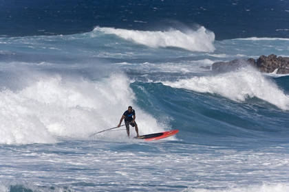 Stand Up Paddle  in waves at Hookip'a Beach - North Shore Maui - Hawaii.