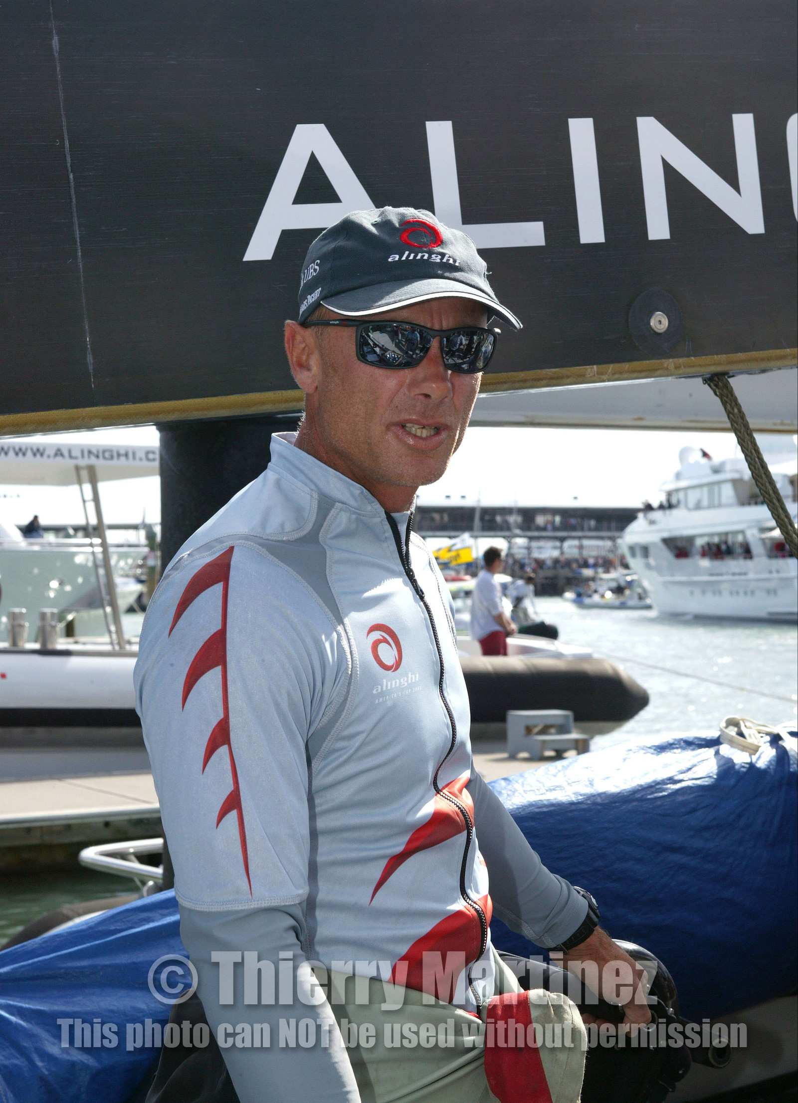 03_0874D © Th.Martinez. Auckland   New Zealand. 15 02 03 America's Cup Day 1.Alinghi (SUI64) vs Team New Zealand (NZL82)Alinghi Team onboard SUI64 leaving the dock for .the first race day of the America's Cup 2003. Richard Bouzaid.