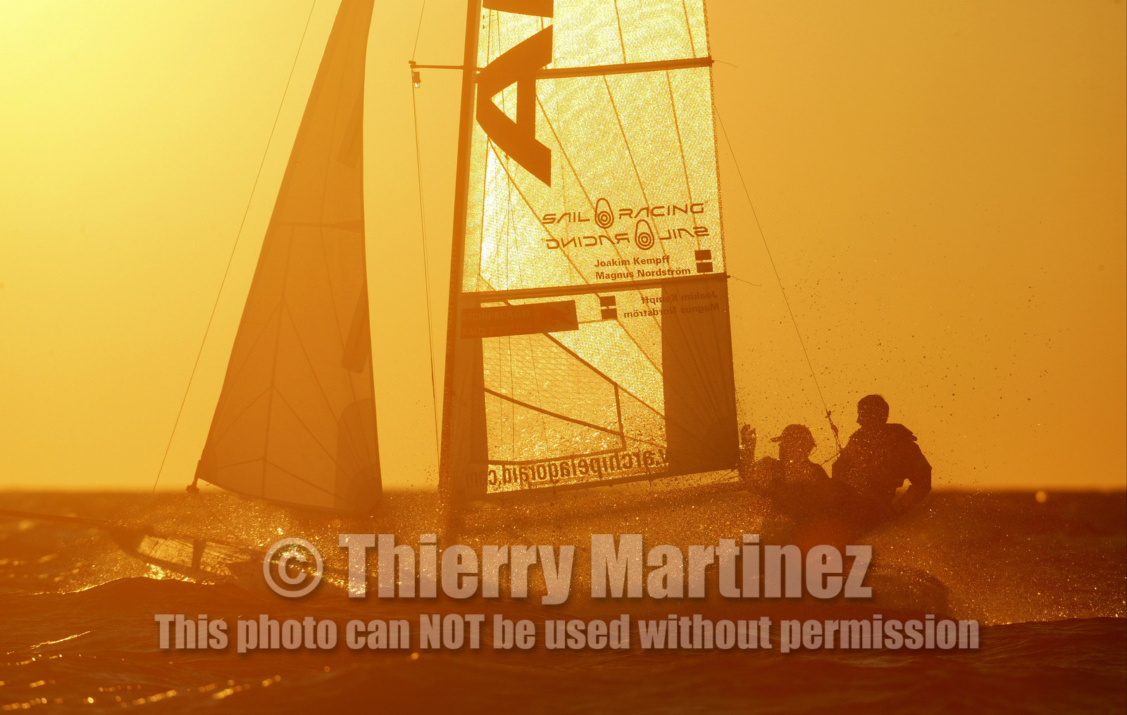 03_3241D © Th.Martinez,STOCKHOLMSWEDEN10 07 03-Archipelago Raid (2003).Leg4: Marieham (Finland) to Fejan (Sweden) . Team Nokia-Kempff in sunset light.