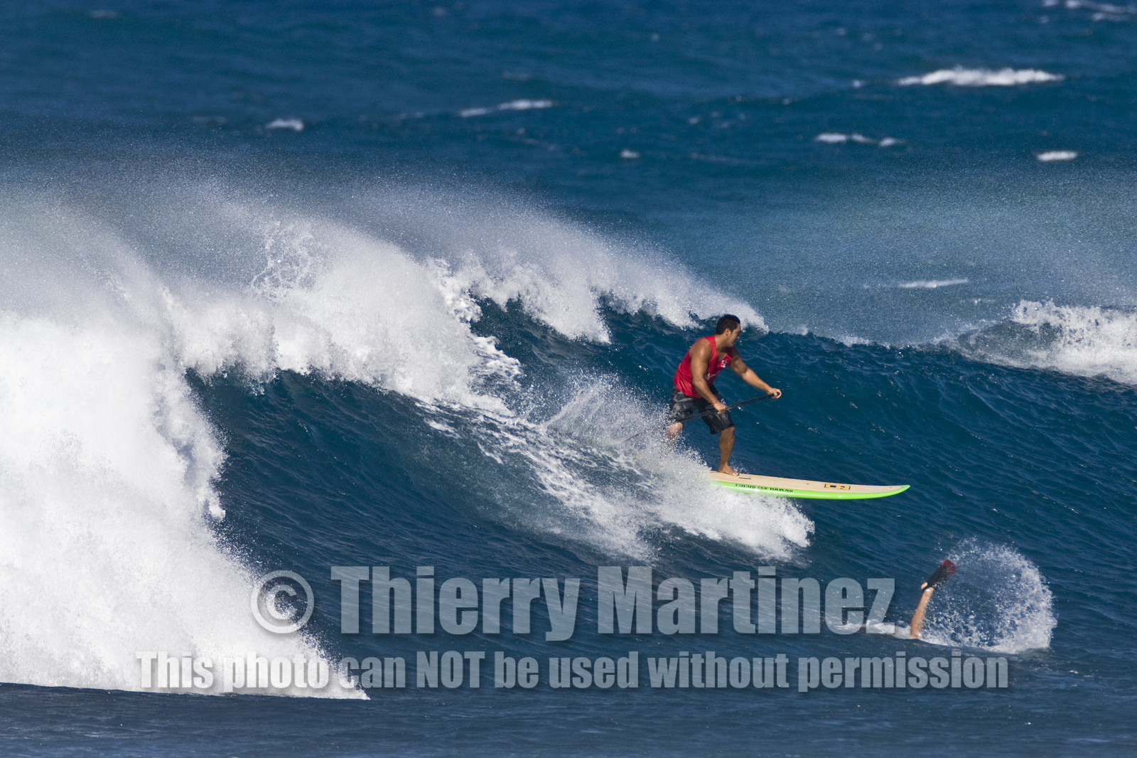 Stand Up Paddle  in waves at Hookip'a Beach - North Shore Maui - Hawaii.