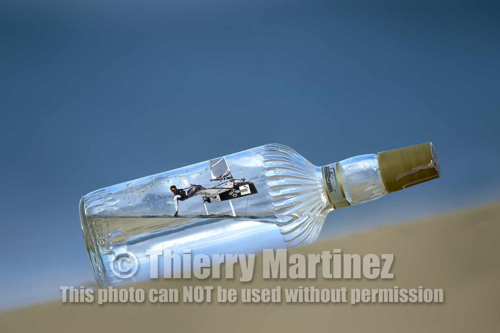 Photomontage.  Bora Gulari (USA) flying Moth in a bottle.