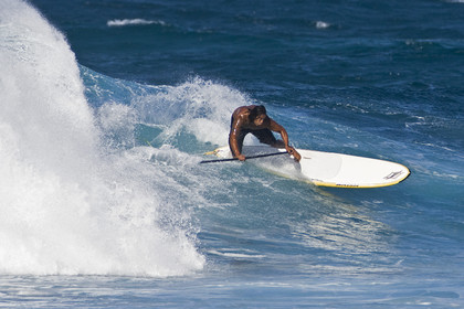 Stand Up Paddle  in waves at Hookip'a Beach - North Shore Maui - Hawaii.