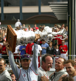 03_1448D © Th.Martinez . Auckland   New Zealand. 2nd March 2003 America's Cup 2003. Day 5, Alinghi (SUI64) vs Team New Zealand (NZL82). Alinghi winner of the 31st America's Cup. Docking ceremony, presentation of the America's Cup in the Viaduct Bassin.Ernesto Bertarelli (President and navigator) Holding The CUP