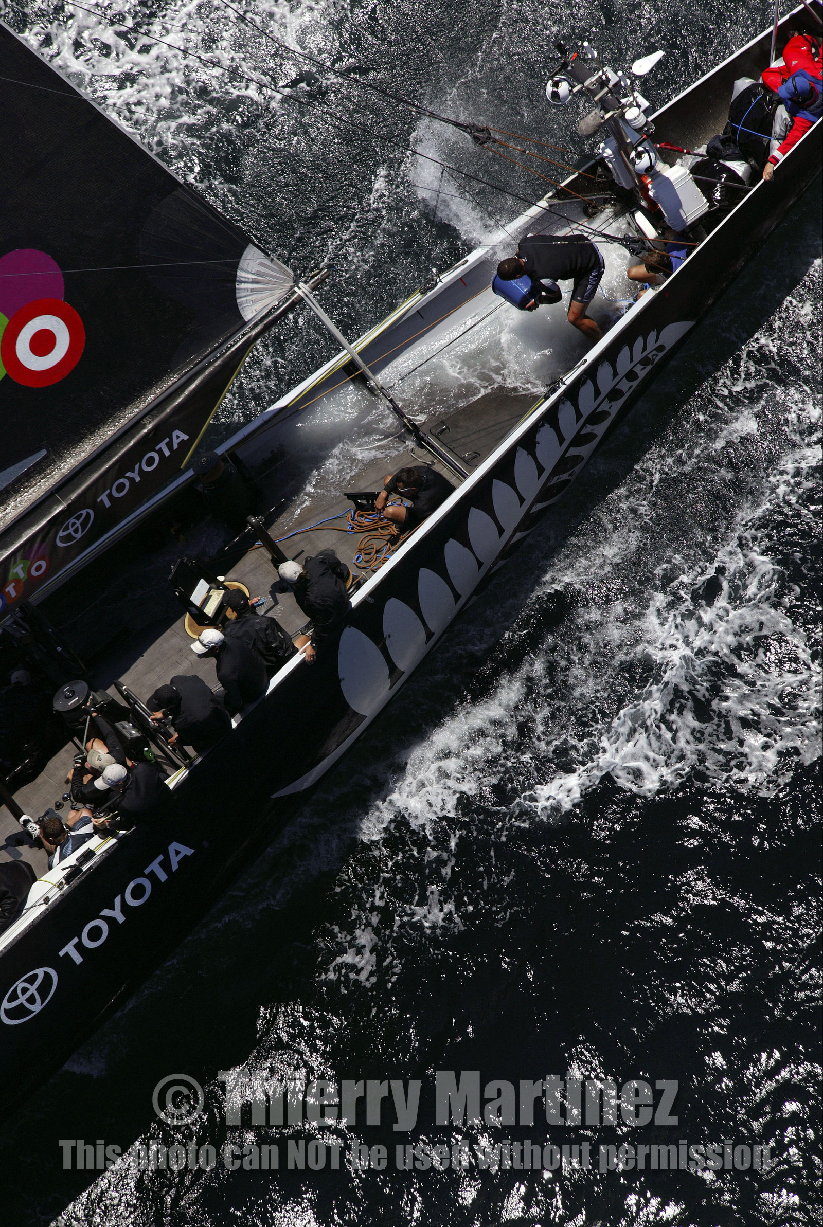 03_0177D ©Th.Martinez - Auckland (NZ) . America's Cup 2003. 15th February 2003. Day 1..Alinghi (SUI 64) vs Team NZ (NZL 82) .NZL 82 in first minutes of Race 1 before retiring on damage. Alinghi 1- Team NZ 0.