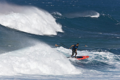 Stand Up Paddle  in waves at Hookip'a Beach - North Shore Maui - Hawaii.