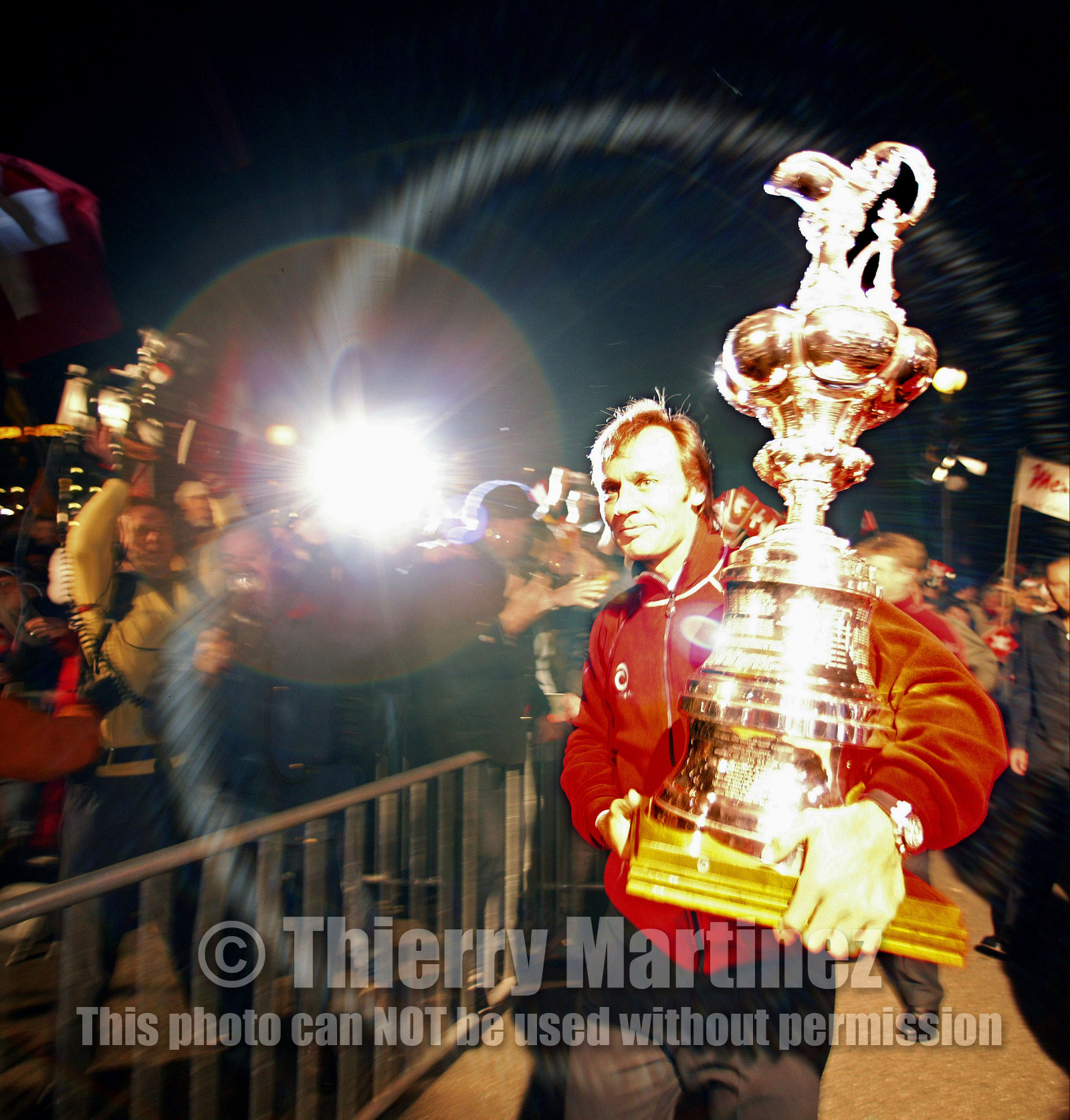 03_2283D ©Th.Martinez .Geneva , Switzerland. America's Cup 2003. 8th March 2003.Alinghi Team winner of America's Cup 2003..Welcome to Alinghi Team in Geneva. Ernesto Bertarelli arriving with the CUp at la Rotonde..