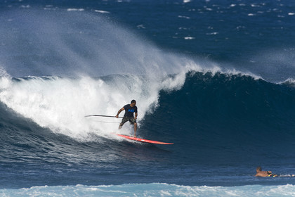 Stand Up Paddle  in waves at Hookip'a Beach - North Shore Maui - Hawaii.