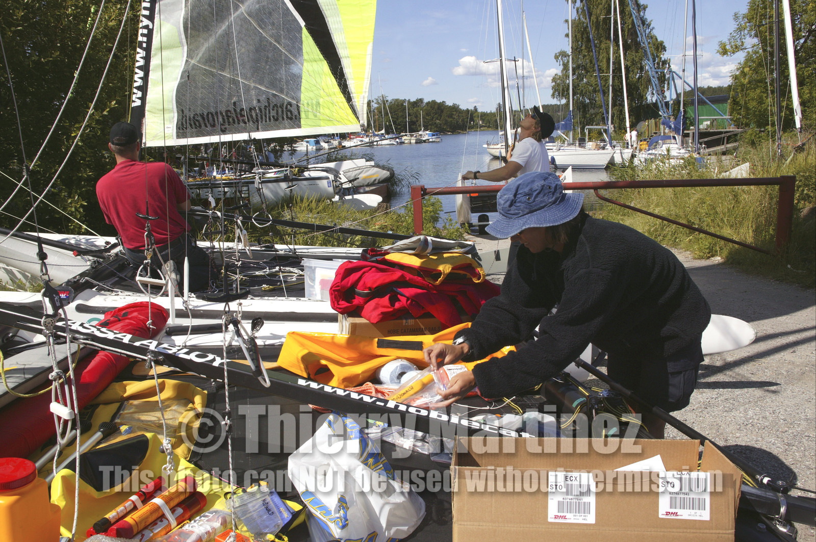 03_3146D © Th.Martinez,STOCKHOLM SWEDEN, 7 07 03-Archipelago Raid (2003) Day 1. Lisa McDonald (USA) preparing safety gear for the Raid.