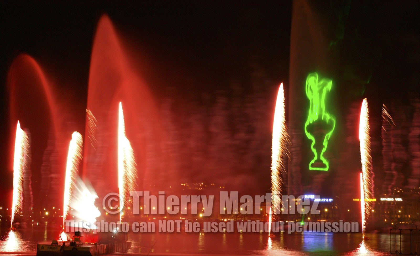 03_2275D ©Th.Martinez .Geneva , Switzerland. America's Cup 2003. 8th March 2003.Alinghi Team winner of America's Cup 2003..Welcome to Alinghi Team in Geneva.Firework and laser show by the lac...