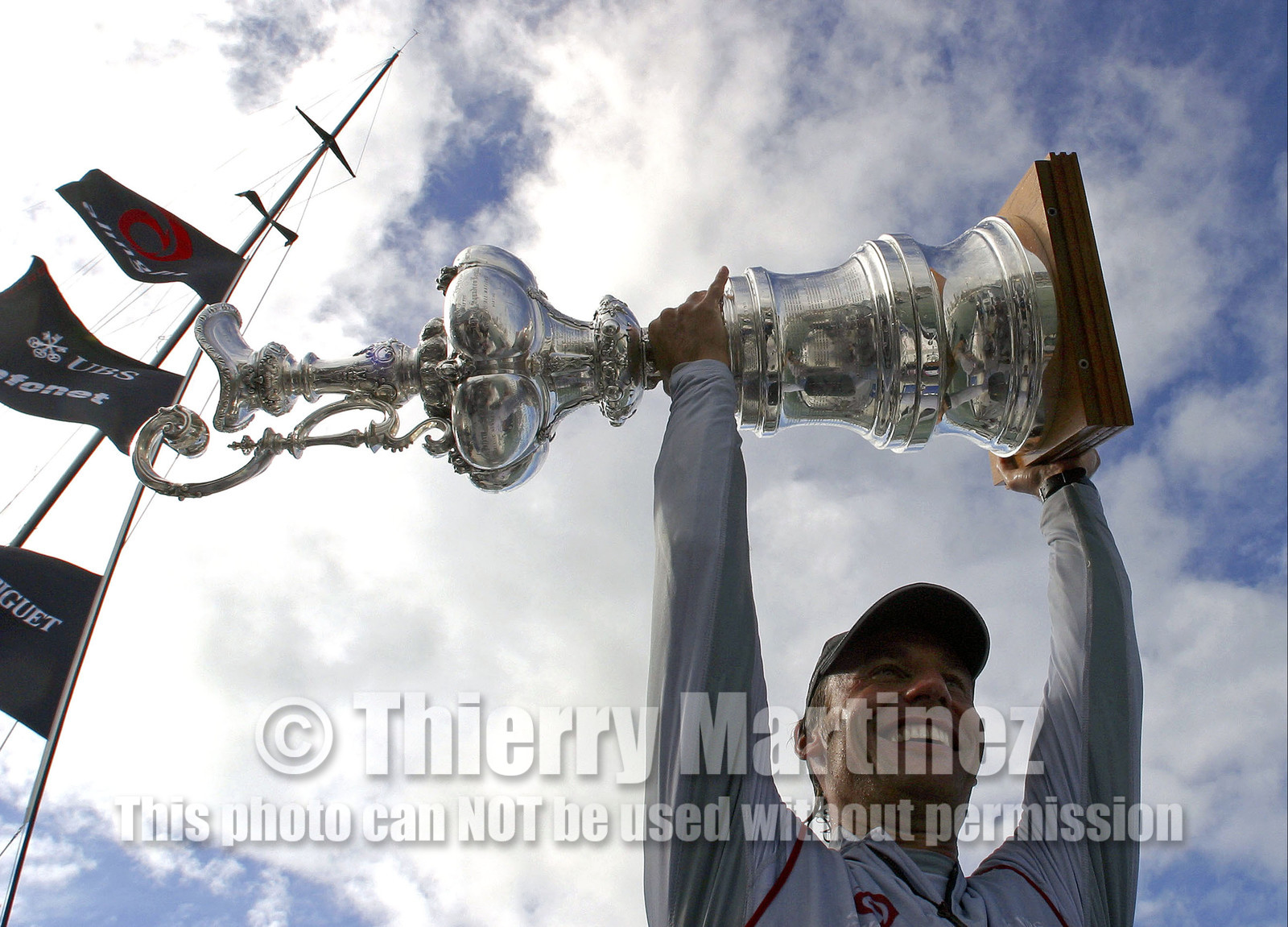 03_1507D ©Th.Martinez - Auckland (NZ) . America's Cup 2003. 2nd March 2003.Alinghi Team winner of America's Cup 2003.Ernesto Bertarelli (President and Navigator of Alinghi Team) Holding The America's Cup...
