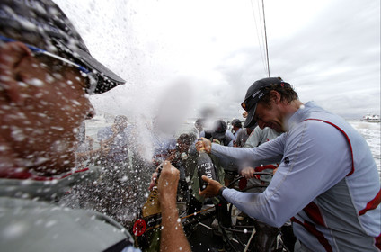 03_1403D © Th.Martinez . Auckland   New Zealand. 2nd March 2003 America's Cup 2003. Day 5, Alinghi (SUI64) vs Team New Zealand (NZL82). Alinghi winner of the 31st America's Cup. Champagne on board for Alinghi Team after Victory .