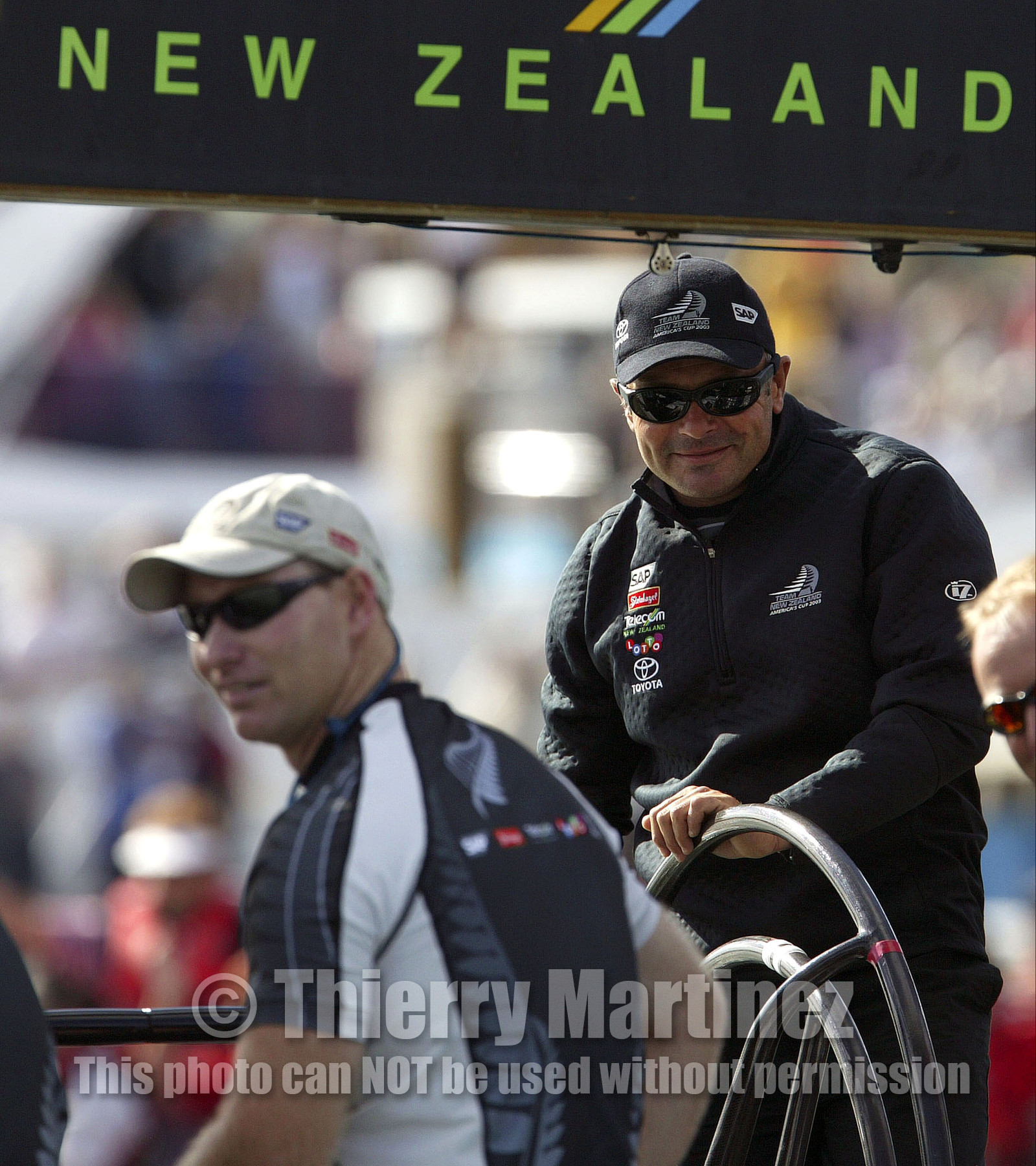 03_0146D ©Th.Martinez - Auckland (NZ) . America's Cup 2003. 15th February 2003. Day 1..Team NZ  NZL 81 leaving Viaduct Harbour to warm up NZL82 to defend 31st America's cup against Challenger Team Alinghi in first race. Frenchman Bertarnd Pace is at the helm of second Team NZ's boat :NZL 81.