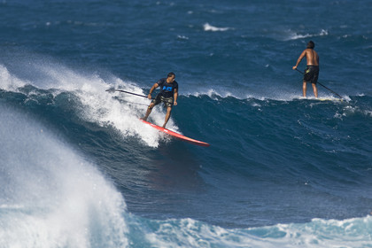Stand Up Paddle  in waves at Hookip'a Beach - North Shore Maui - Hawaii.