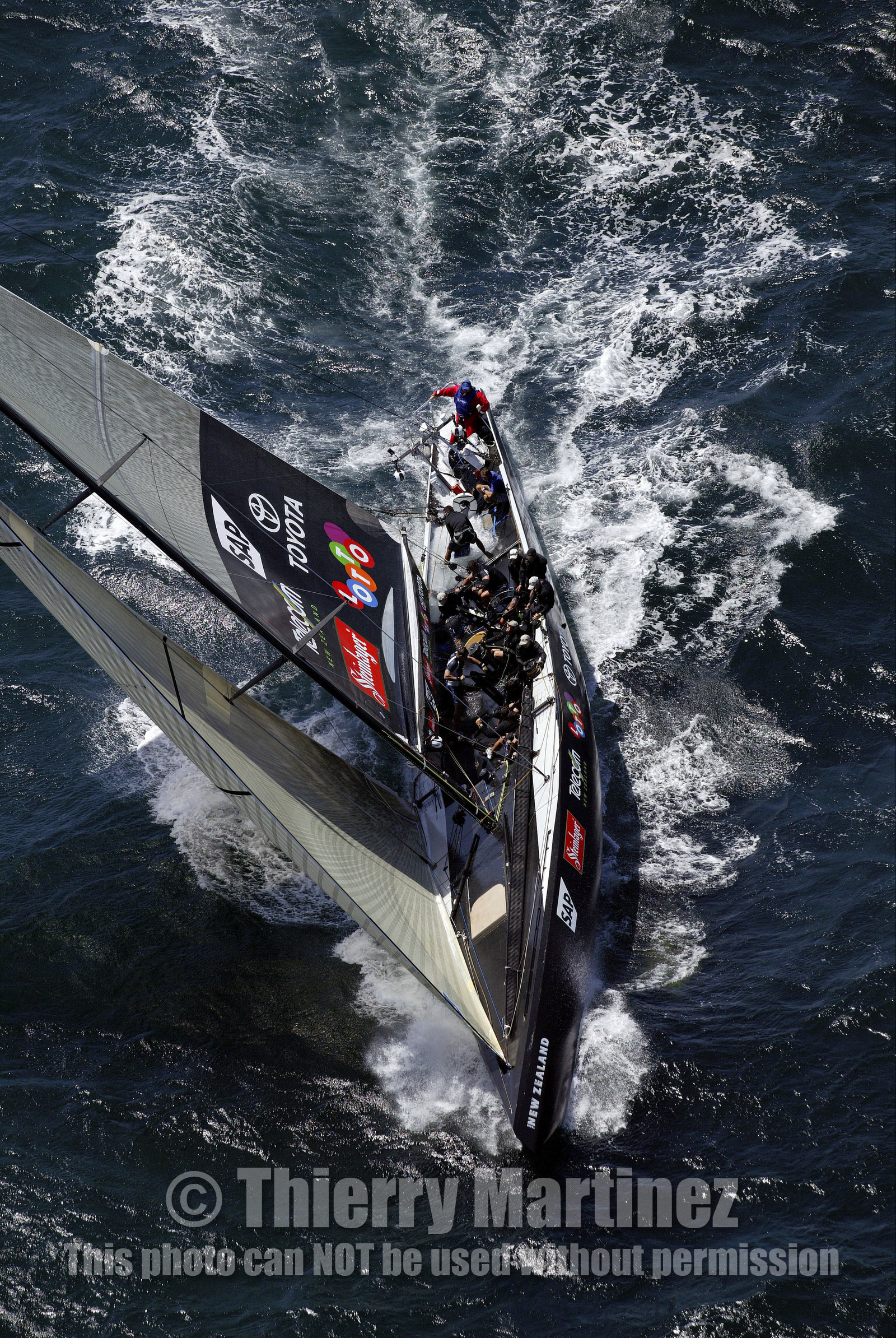 03_0157D ©Th.Martinez - Auckland (NZ) . America's Cup 2003. 15th February 2003. Day 1..Alinghi (SUI 64) vs Team NZ (NZL 82) .NZL 82 in first minutes of Race 1 before retiring on damage. Alinghi 1- Team NZ 0.