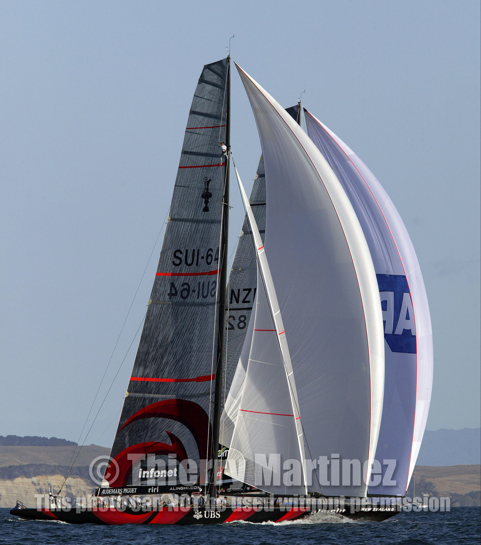 03_0954D © Th.Martinez  Auckland   New Zealand. 16 February 2003 America's Cup 2003, Day 2.Alinghi (SUI64) vs Team New Zealand (NZL82) Last downwind leg. Alinghi over taking Team NZ.